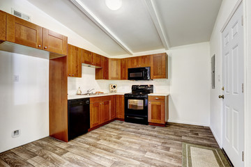 Kitchen cabinets with black appliances