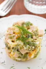 vegetable salad on plate and glass of water