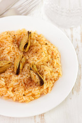 rice with mussels on white plate