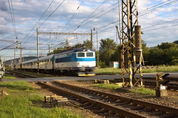 Fototapeta na wymiar blurred passenger train departs from the small station