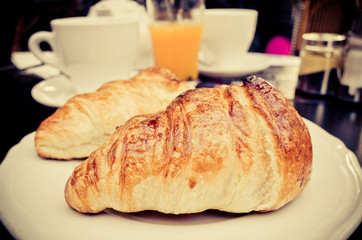 Breakfast with coffee and croissants