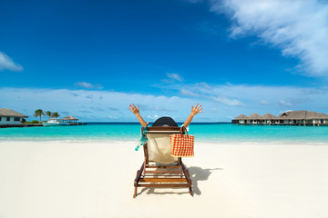 Happy women in bikini on tropical beach