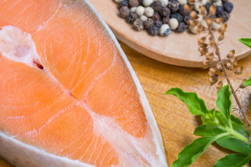 Salmon steak on wooden board