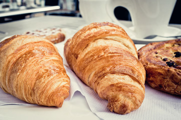 Breakfast with coffee and croissants