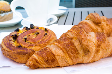 Breakfast with coffee and croissants