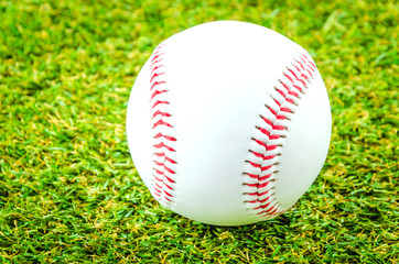 Baseball on green grass