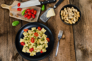 Home made ravioli with basil pesto