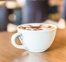 Coffee cup in coffee shop interior