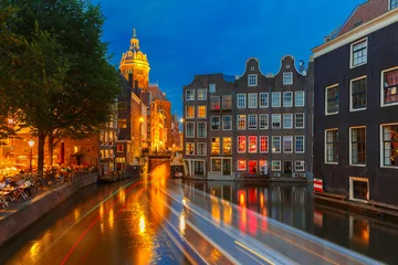 Gordijnen Night city view of Amsterdam canal, church and bridge © Kavalenkava