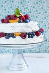 Meringue cake with fresh berries. Pavlova cake