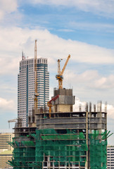 Crane and workers at construction site