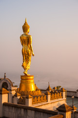 Golden Buddha statue in Wat Phra That Khao Noi, Nan Province, Th