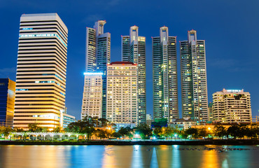 Fototapeta premium city downtown at night with building reflection in the river Ban