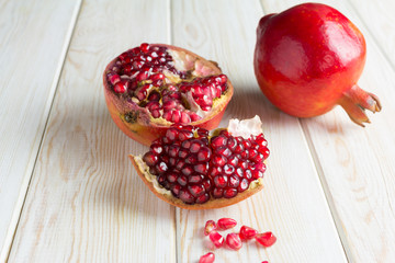 Juicy pomegranates on wood