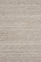 Ecru rough plaster on wall closeup