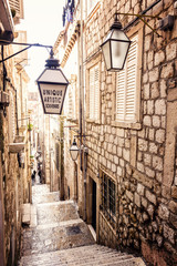 Steep stairs and narrow street in old town of Dubrovnik - obrazy, fototapety, plakaty