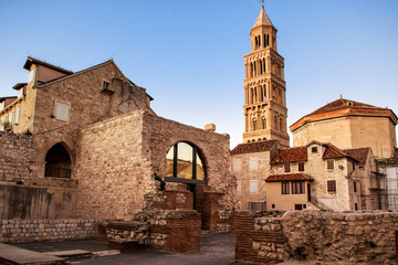 Scene from the old city of Split and the view of old bell tower - obrazy, fototapety, plakaty