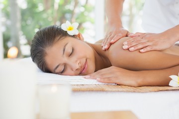 Obraz na płótnie Canvas Beautiful brunette enjoying a massage