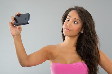 Black woman taking funny selfie