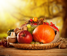 Autumn harvested fruit and vegetable on wood