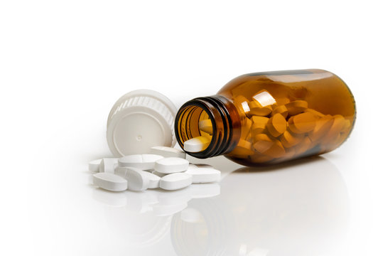 Yellow Pill Bottle Isolated On A White Background