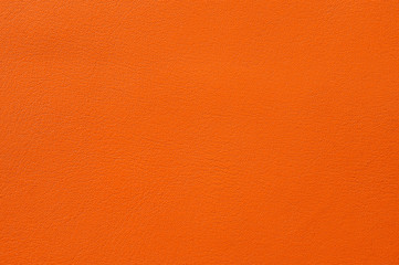 Closeup of seamless orange leather texture