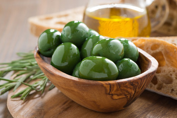 fresh green olives, olive oil and bread