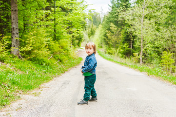 Cute toddler boy in a forest