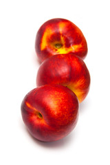 .Nectarines isolated on a white studio background.