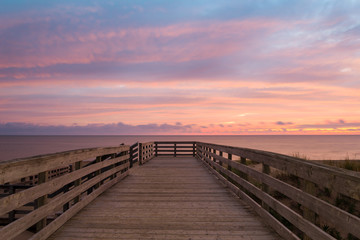Fototapeta na wymiar Boardwalk on Cavendish beach at the crack of dawn