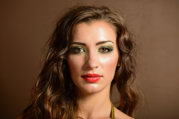 Fototapeta premium Portrait of beautiful young woman with bright make-up