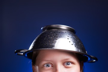 Girl with a colander on her head