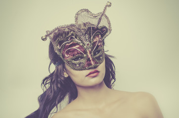 Beautiful young woman wearing Venetian mask © BCFC
