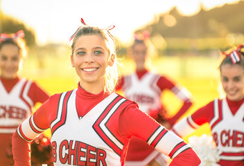 Portrait of happy young cheerleader in action - Sport outdoors