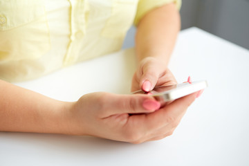 Female hand holding a cell phone