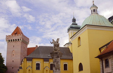 Monument of Poznan Lancers against the church and the castle