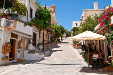Fototapeta na wymiar Tourists have a rest in Rethymno city. Crete island, Greece.