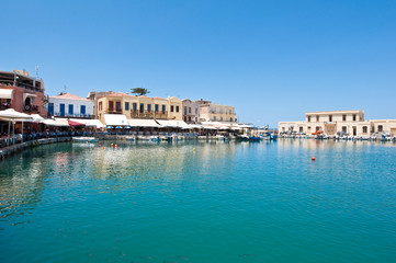 Fototapeta na wymiar Old venetian harbour with various restaurants. Crete, Greece.