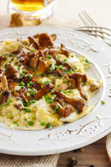 Traditional scrambled eggs with fresh chanterelle