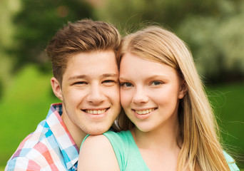 Fototapeta premium smiling couple hugging in park