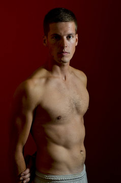 Young male model posing with bare chest