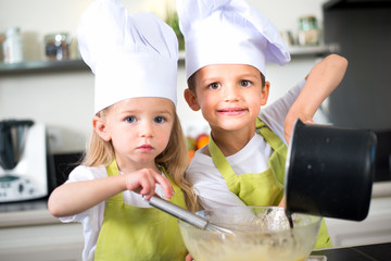 happy children kids family preparing funny cake kitchen at home