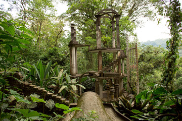 concrete structure with stairs surrounded by jungle