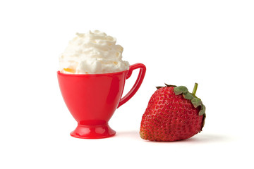 Strawberry and whipped cream in red cup