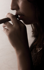 woman smokes a cigar