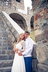 The couple standing at the Church