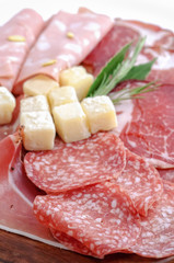 Mix  italian antipasto with prosciutto and parmigiano