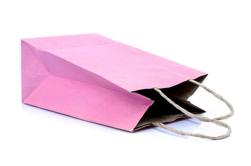 Pink paper bag on white background