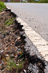 Damaged asphalt road, bad road