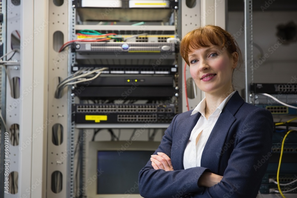 Aufkleber Pretty computer technician smiling at camera while fixing server